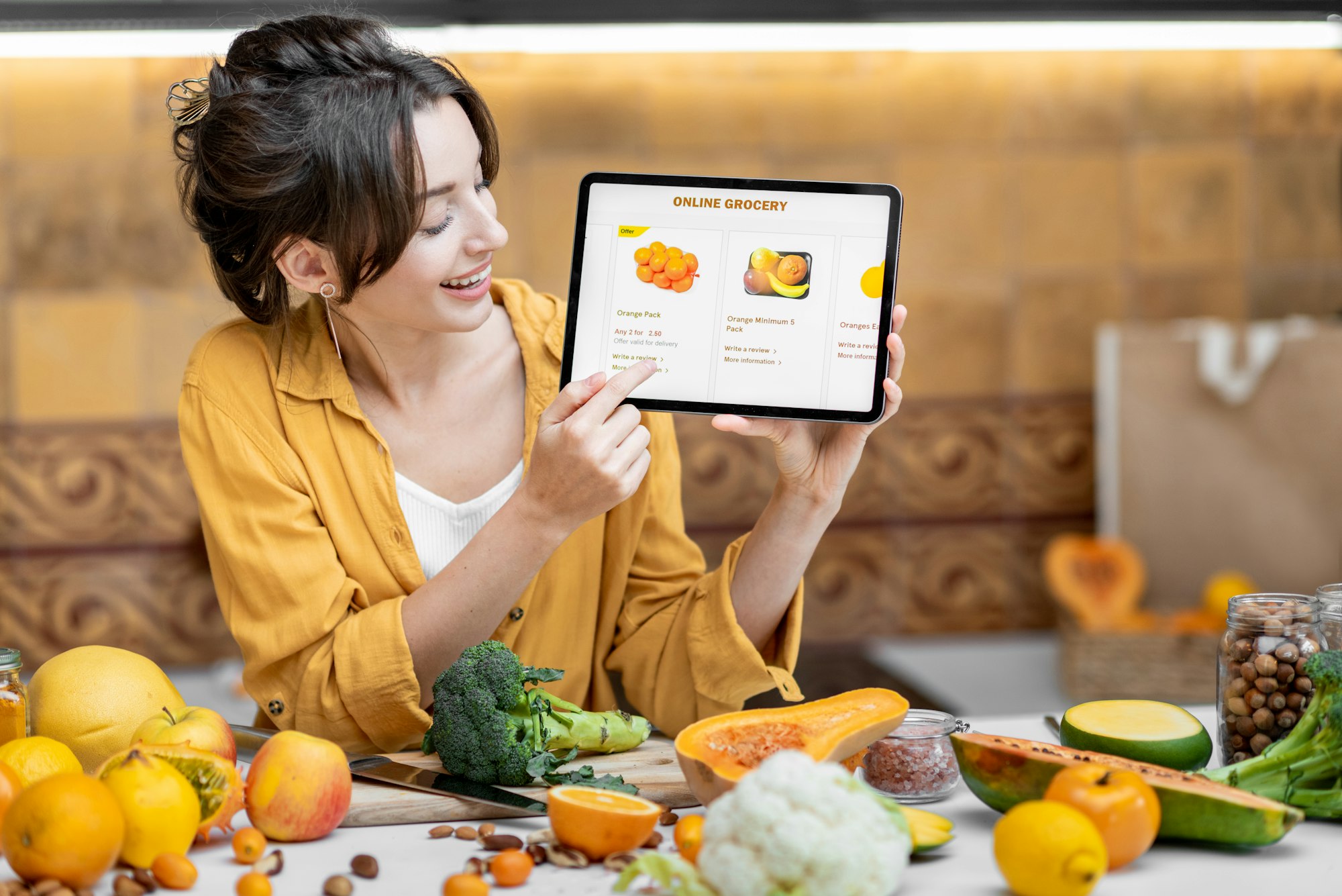 Woman shopping online using digital tablet