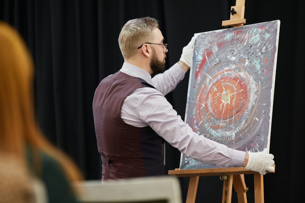 Artist with his painting