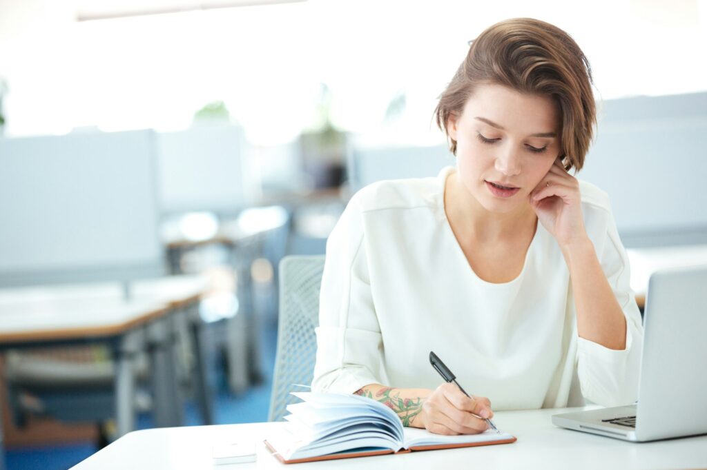 Businesswoman talking on the phone in office